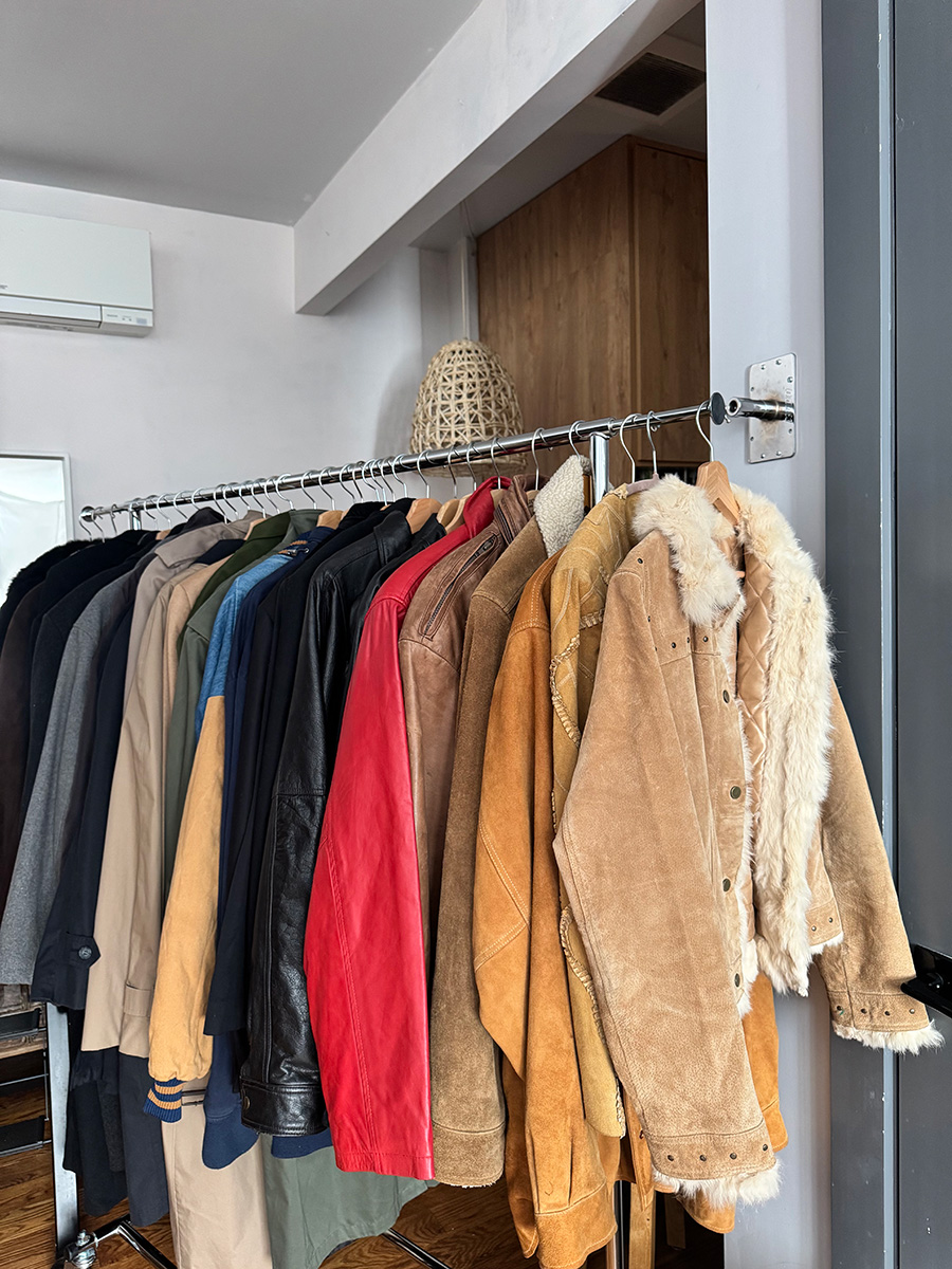A customer trying on a curated piece during personalized styling with Cassandra